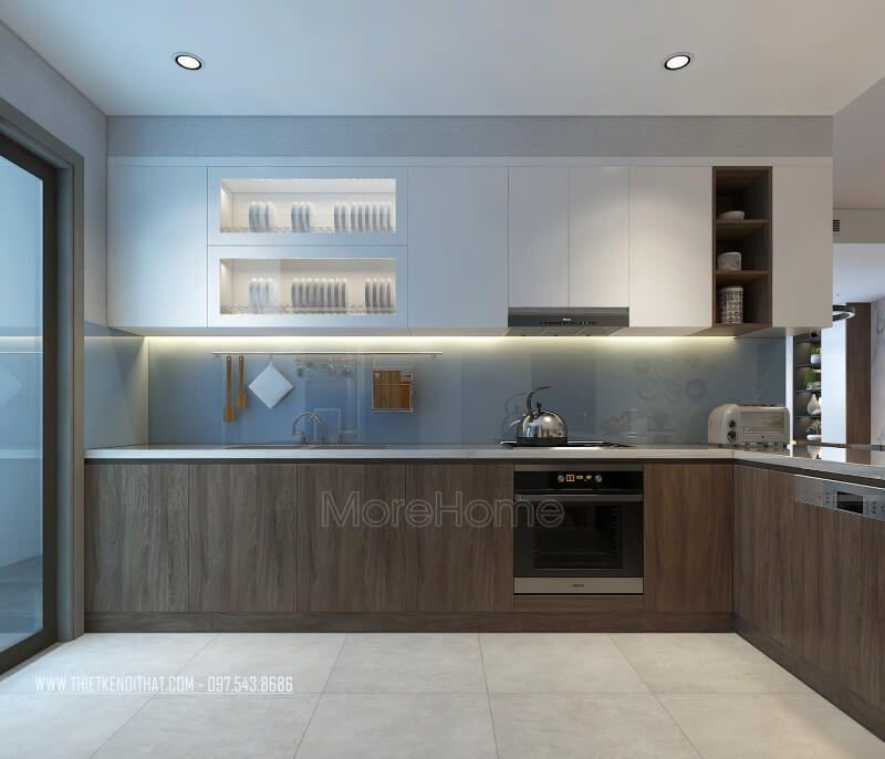 Phòng bếp được thiết kế với hệ tủ bếp hiện đại 2 màu trắng và nâu tạo sự sinh động cho không gian bếp. Khoảng cách giữa 2 hệ tủ này được thiết kế với mẫu kính ốp bếp kim sa màu trắng xanh tạo sự nhẹ nhàng, tinh tế khi sử dụng.