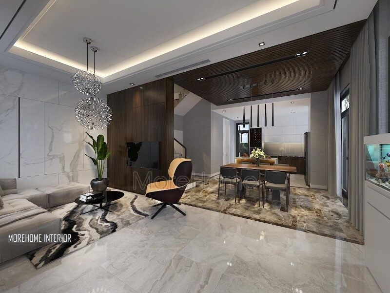 Điểm nhấn ấn tượng giữa gỗ ốp tường cùng đá lát sàn cao cấp tạo nên ánh nhìn hiện đại, cuốn hút cho phòng khách liền bếp ăn.